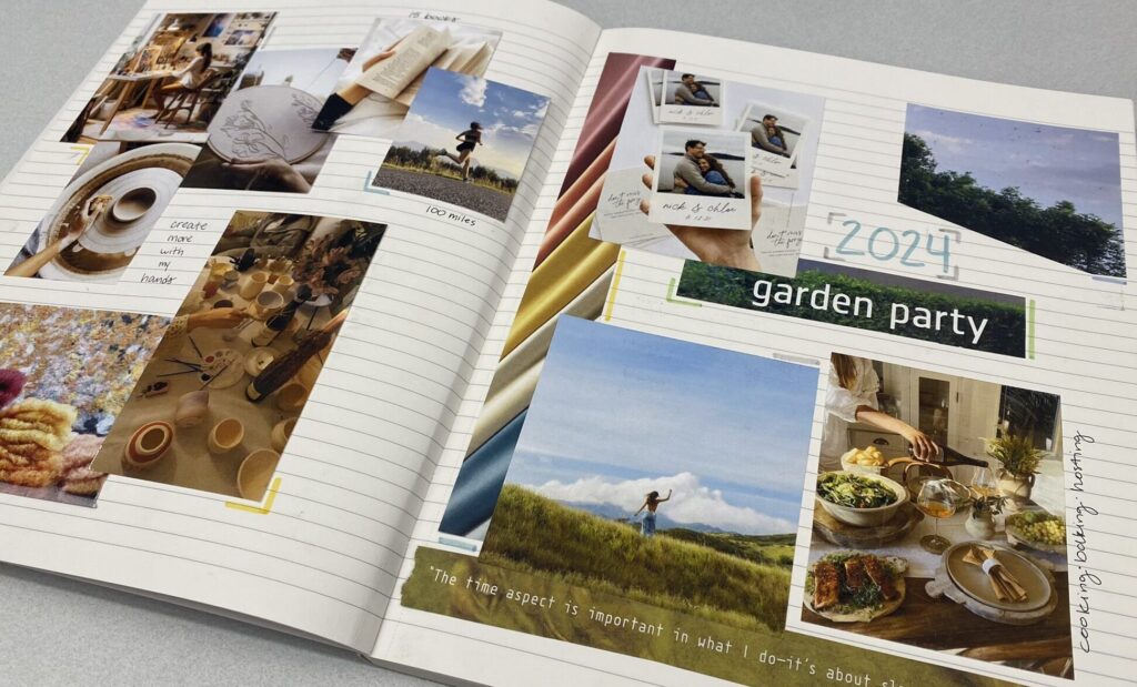 Vision board with images taped inside notebook with lined paper